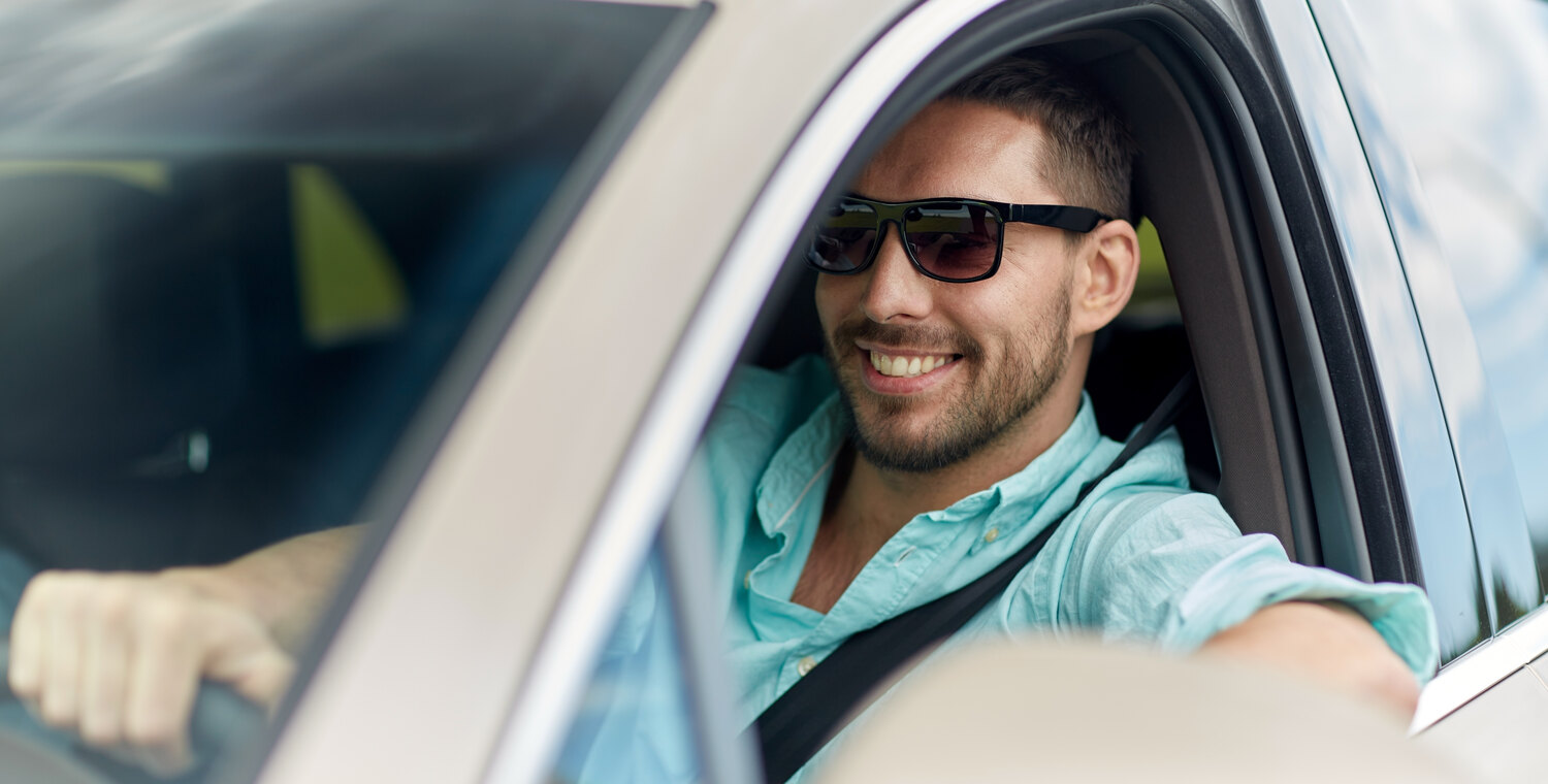 Driver wearing polarized sunglasses at the wheel